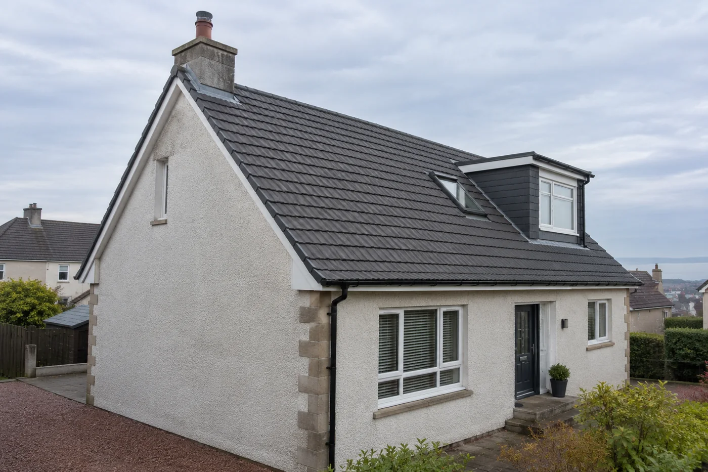 Domestic gable roof showing chimney and roof edges