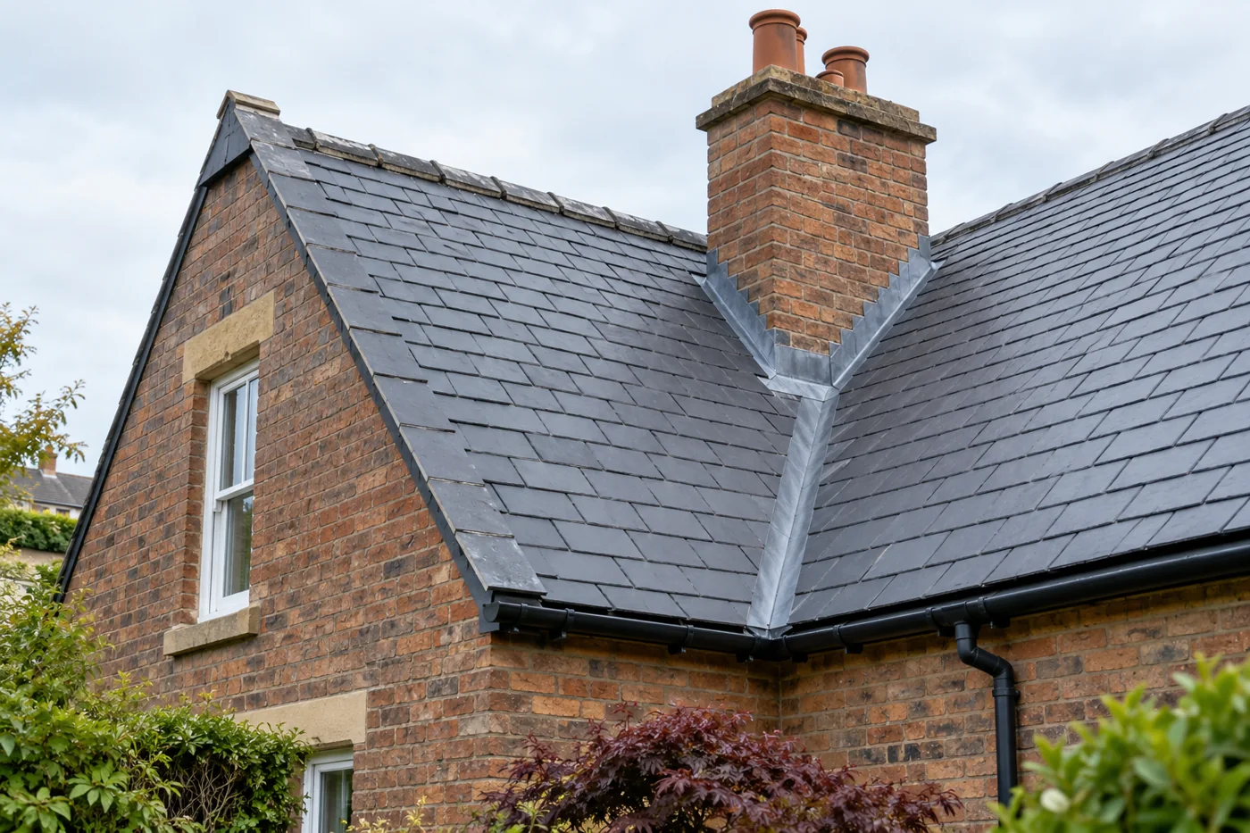 Slate valley and chimney flashing junction